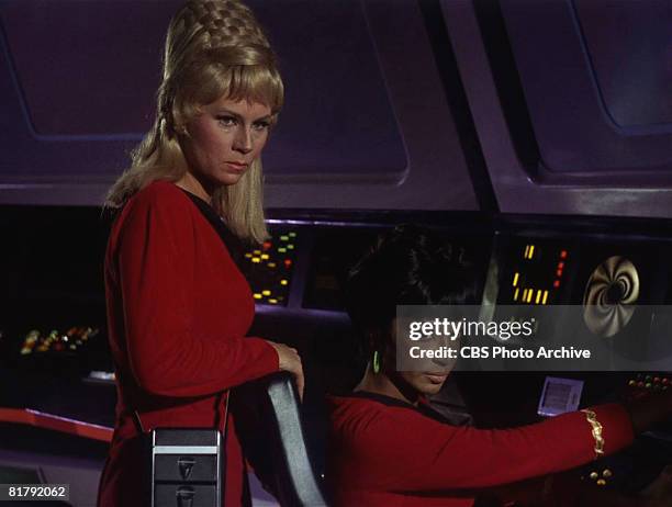 American actresses Grace Lee Whitney, as Yeoman Janice Rand, and Nichelle Nichols, as Lieutenant Uhura, at the controls of the Starship Enterprise in...