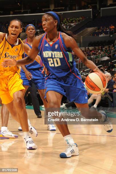 Shameka Christon of the New York Liberty drives the ball against Murriel Page of the Los Angeles Sparks during the game on July 1, 2008 at Staples...