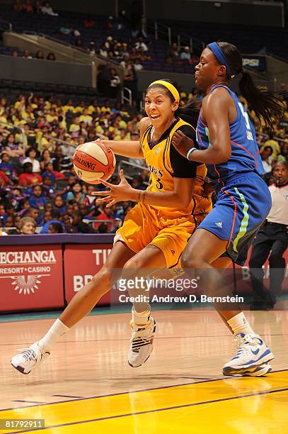Candace Parker of the Los Angeles Sparks drives through Tiffany Jackson of the New York Liberty on July 1, 2008 at Staples Center in Los Angeles,...