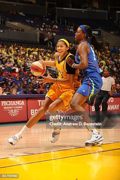 Candace Parker of the Los Angeles Sparks drives through Tiffany Jackson of the New York Liberty on July 1, 2008 at Staples Center in Los Angeles,...