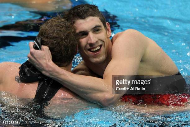 Michael Phelps hugs sixth place finisher Erik Vendt after Phelps won the final of the 200 meter freestyle during the U.S. Swimming Olympic Trials on...