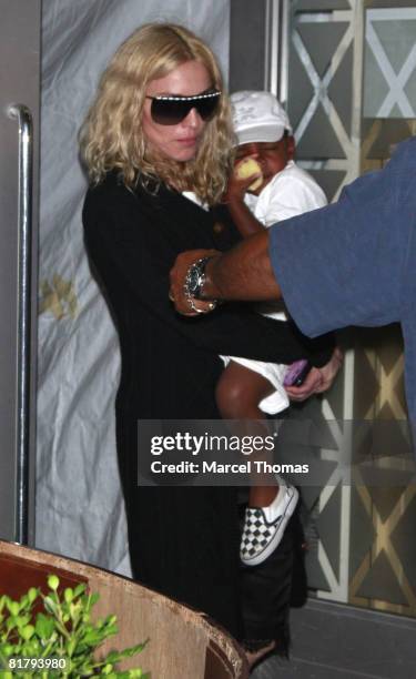 Singer Madonna and son David Banda attend Friday night prayers at the Kaballah Center in Manhattan on June 27, 2008 in New York City.