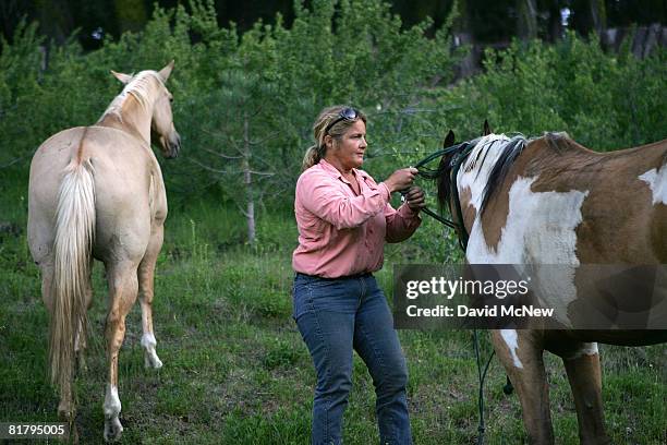 Arrow T Ranch owner Tami Bailey evacuates horses from the path of the Piute fire while more than 1,400 wildfires continue to burn across about 550...