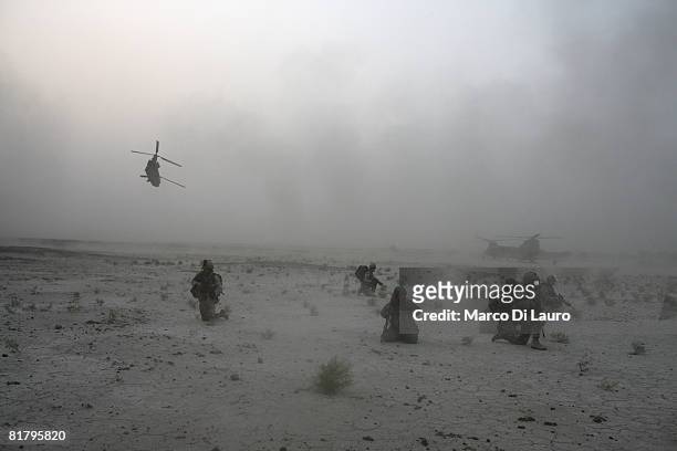 British Paratroopers from the 3rd Battalion The Parachute Regiment deploy from royal Air Force Chinook Helicopter during an operation to search three...