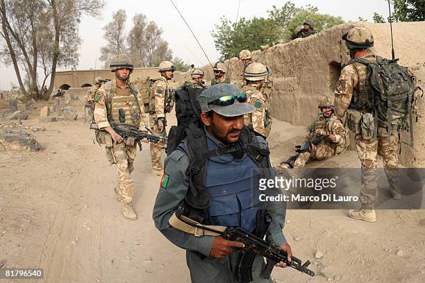Member of the Afghan Security Forces and British Paratroopers from the 3rd Battalion The Parachute Regiment take part in an operation to search three...