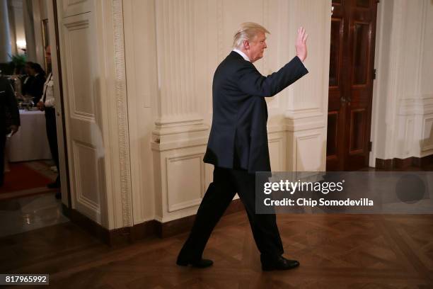 President Donald Trump waits to take the stage during a Made in America product showcase in the East Room of the White House July 17, 2017 in...