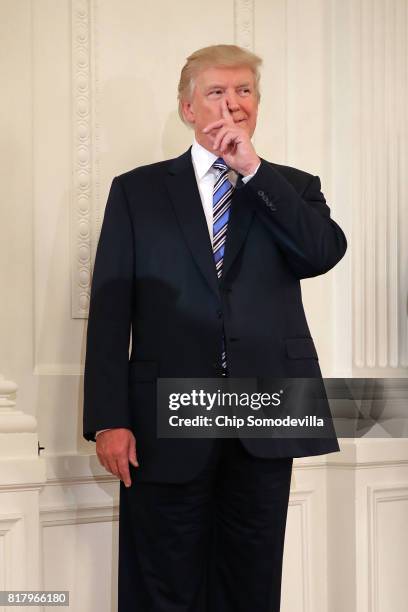 President Donald Trump waits to take the stage during a Made in America product showcase in the East Room of the White House July 17, 2017 in...