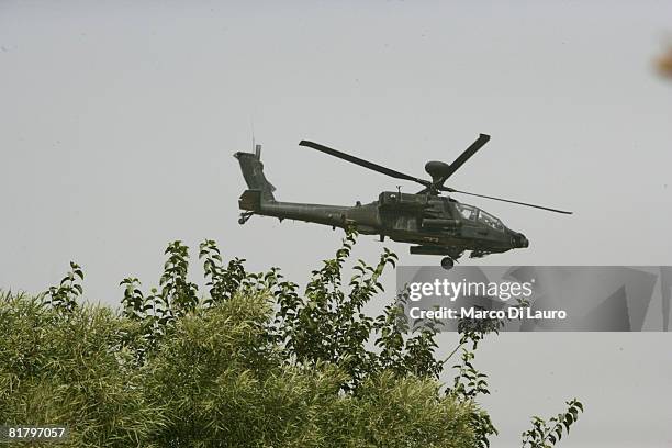 British Army Apache helicopter flies over British Paratroopers from the 3rd Battalion The Parachute Regiment during an operation to search three...