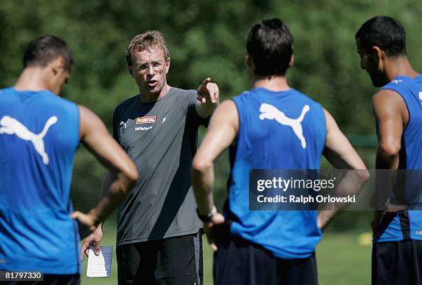 Ralf Rangnick , head coach of TSG 1899 Hoffenheim speaks to his players during a training session at their training camp on July 2, 2008 in...