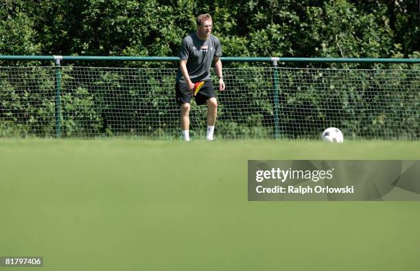 Ralf Rangnick, head coach of TSG 1899 Hoffenheim puts down a mark during a training session at their training camp on July 2, 2008 in Stahlhofen near...