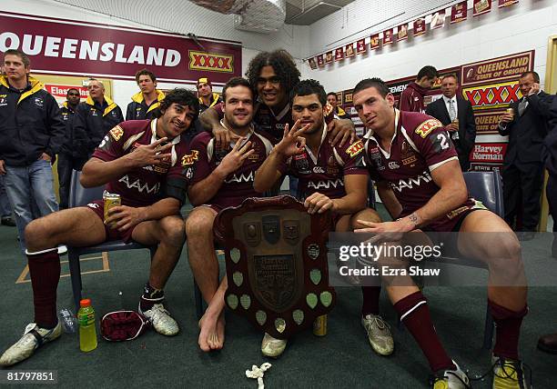 Johnathan Thurston, Nate Myles, Sam Thaiday, Karmichael Hunt and Darius Boyd of the Maroons celebrate in the changing rooms after the Maroons won...