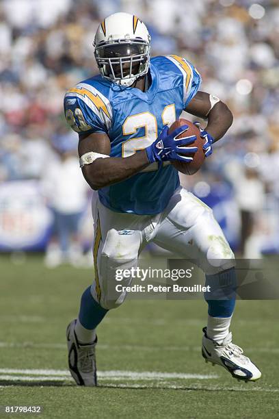 LaDainian Tomlinson, running back for the San Diego Chargers, rolls out looking to pass to quarterback Drew Brees in a game against the Jacksonville...