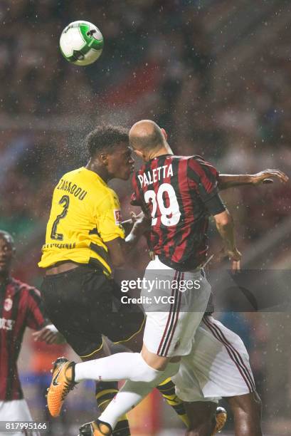 Gabriel Paletta of AC Milan and Dan-Axel Zagadou of Borussia Dortmund compete for the ball during the 2017 International Champions Cup China between...