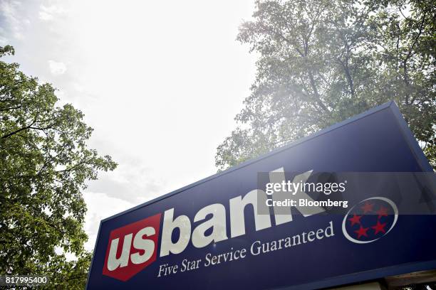 Bancorp signage stands outside a branch in Bloomington, Illinois, U.S., on Monday, July 10, 2017. US Bancorp is scheduled to release earnings figures...