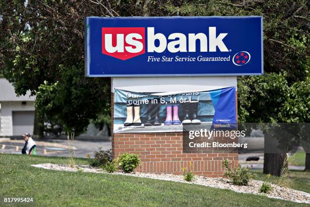 Bancorp signage stands outside a branch in Bloomington, Illinois, U.S., on Monday, July 10, 2017. US Bancorp is scheduled to release earnings figures...