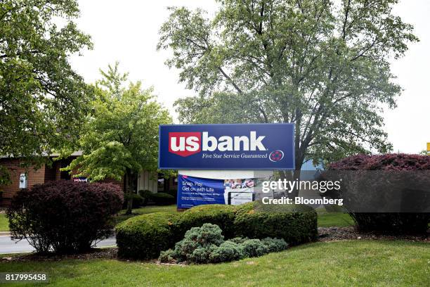 Bancorp signage stands outside a branch in Bloomington, Illinois, U.S., on Monday, July 10, 2017. US Bancorp is scheduled to release earnings figures...