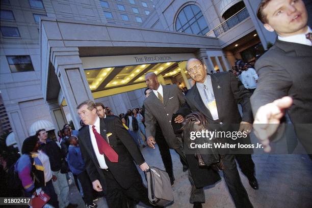 Basketball: Casual view of Chicago Bulls Michael Jordan leaving Ritz Carlton Hotel with bodyguard and friend Gus Lett before game vs Washington...