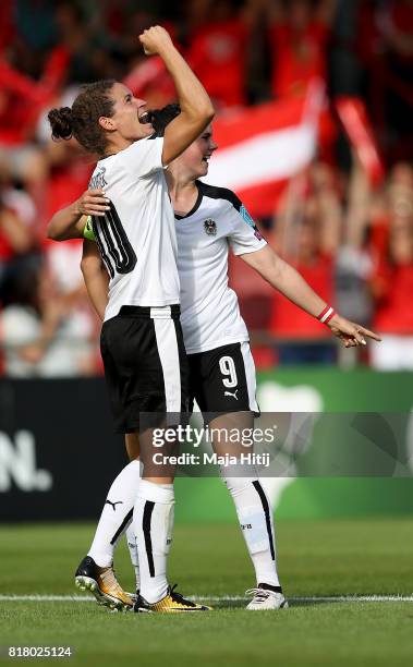 Nina Burger of Austria celebrate with her team mate Sarah Zadrazil after she scores the opening goal during the Group C match between Austria and...