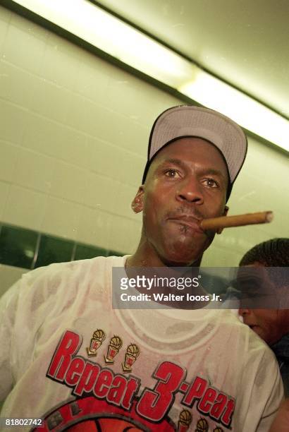 Basketball: NBA finals, Closeup of Chicago Bulls Michael Jordan victorious, smoking cigar after winning game and championship vs Utah Jazz, Salt Lake...