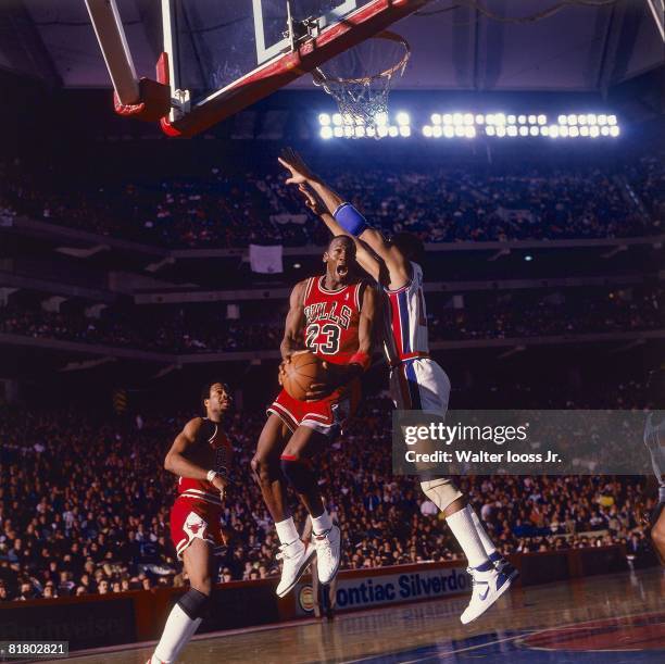 Basketball: Chicago Bulls Michael Jordan in action, layup vs Detroit Pistons, Pontiac, MI 1/1/1984--