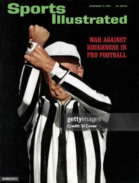 November 11, 1963 Sports Illustrated via Getty Images Cover, Football: Closeup of referee, official signaling holding during Chicago Bears vs Detroit...