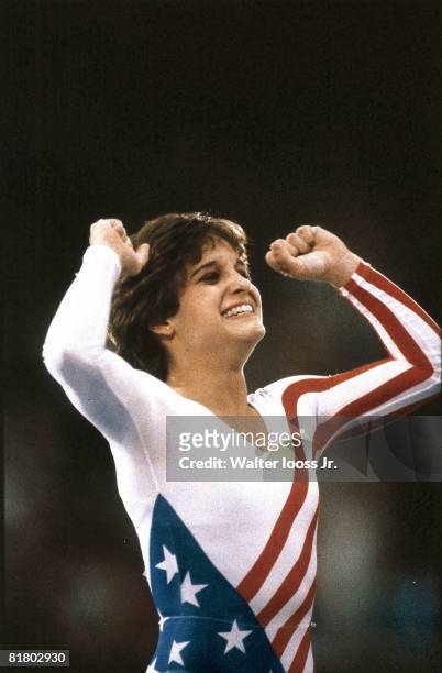 Gymnastics: 1984 Summer Olympics, Closeup of USA Mary Lou Retton victorious after winning All Around Individual competition at Pauley Pavilion,...