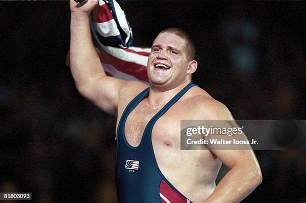 Wrestling: 2000 Summer Olympics, Closeup of USA Rulon Gardner victorious with USA flag after gold medal Greco-Roman match vs RUS Alexandre Kareline,...
