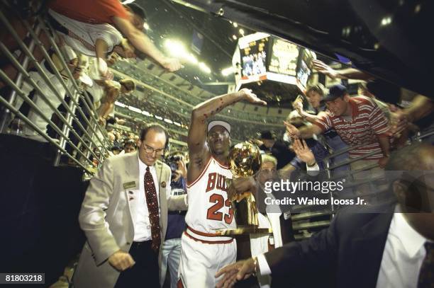 Basketball: NBA Finals, Chicago Bulls Michael Jordan victorious entering tunnel with NBA Championship trophy after winning Game 6 vs Utah Jazz,...