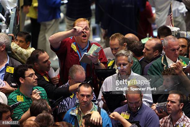 Traders work in the energy options pit on the floor of the New York Mercantile Exchange July 2, 2008 in New York City. Oil prices rose to a new high...
