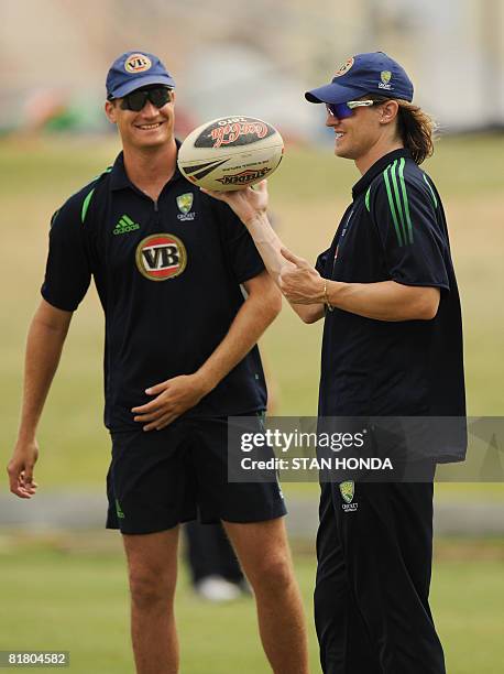 Australian cricketers Stuart Clark and Nathan Bracken play with a rugby ball during a practice session on July 2, 2008 at Warner Park in Basseterre...