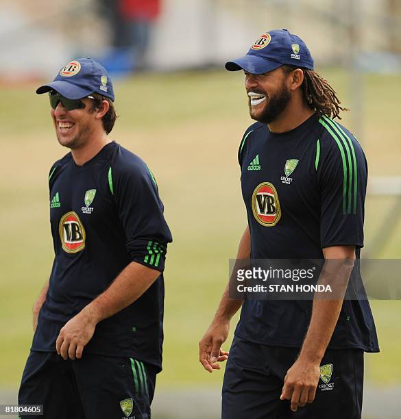 Australian cricketers Luke Ronchi and Andrew Symonds smile during practice session on July 2, 2008 at Warner Park in Basseterre in advance of the...
