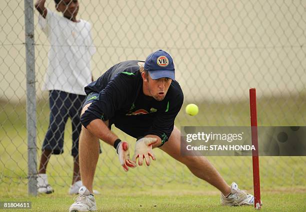 Australian wicketkeeper Luke Ronchi eyes a tennis ball during practice session on July 2, 2008 at Warner Park in Basseterre in advance of the One-Day...