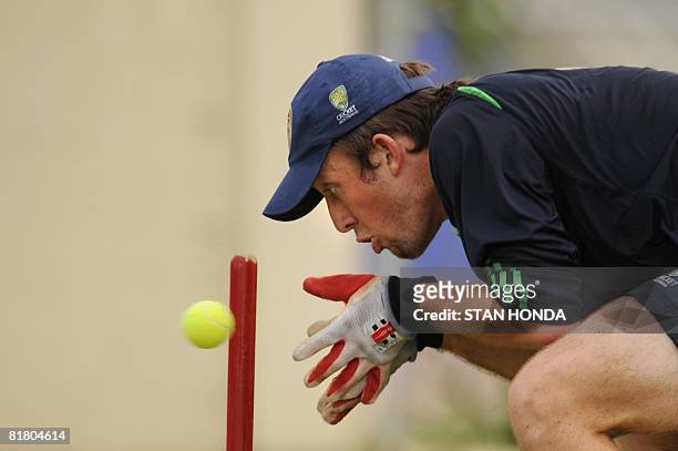 Australian wicketkeeper Luke Ronchi eyes a tennis ball during practice session on July 2, 2008 at Warner Park in Basseterre in advance of the One-Day...