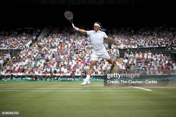 Roger Federer of Switzerland in action against Marin Cilic of Croatia during the Gentlemen's Singles final of the Wimbledon Lawn Tennis Championships...