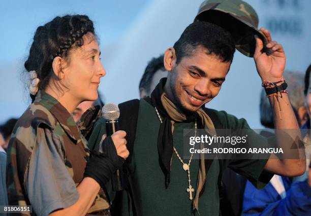 French-Colombian former politician Ingrid Betancourt speaks next to soldier William Perez during a press conference held on July 2, 2008 upon their...