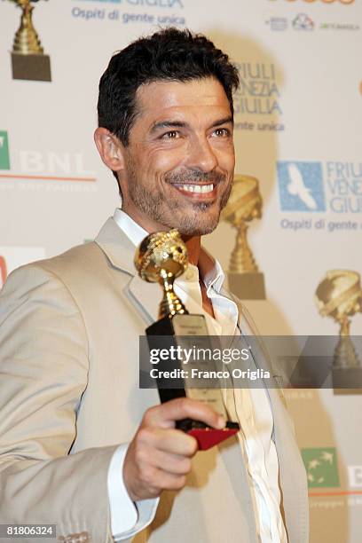 Italian actor Alessandro Gassman poses with the 'Globo D'Oro' Foreign Press Association Award at Villa Massimo June 2, 2008 in Rome, Italy.