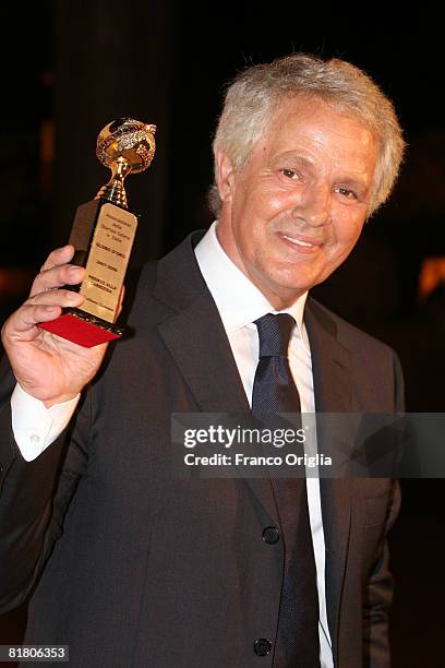 Italian actor Giuliano Gemma poses with the 'Globo D'Oro' Foreign Press Association Award at Villa Massimo June 2, 2008 in Rome, Italy.