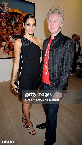 Astrid Munoz and Philip Treacy attend the VIP private view of 'Mario Testino: Obsessed By You', at Phillips de Pury & Company on July 2, 2008 in...