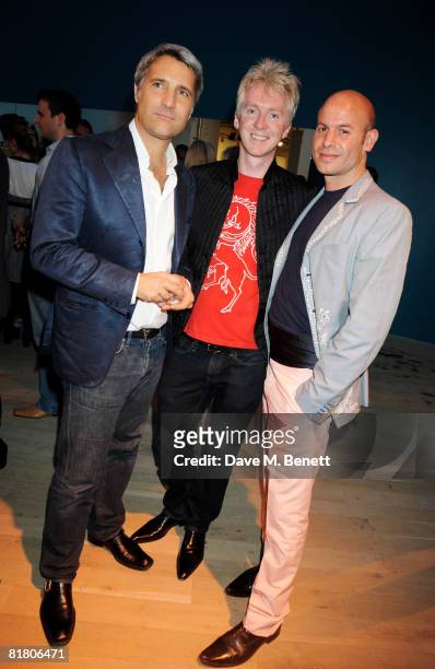 Enrico Quinto with Philip Treacy and partner Stephan Bartlett attend the VIP private view of 'Mario Testino: Obsessed By You', at Phillips de Pury &...