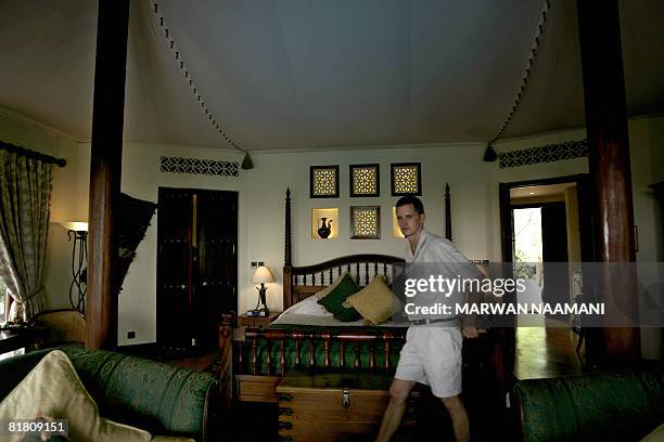 South African ranger walks inside one of the lodges at al-Maha resort and nature reserve, some 100 kms south of the Gulf emirate of Dubai, on June...