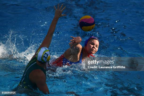 Maria Borisova of Russia shoots past Madeleine Steere of Australia to score during the Women's Water Polo, Group D preliminary round match between...