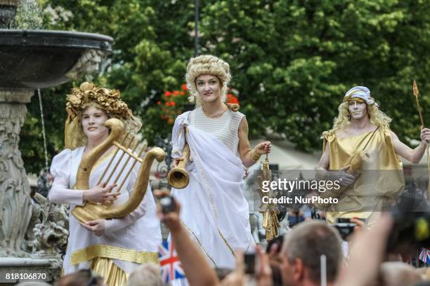 People welcoming Kate Middleton and Prince William with British and Gdansk City flags are seen in front of Artus Court in Gdansk, Poland on 18 July...