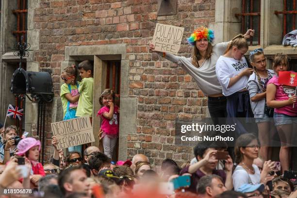 People with banners - Poland Must be Free and Destruction is not reformation protesting against Polish Government, welcoming Kate Middleton and...