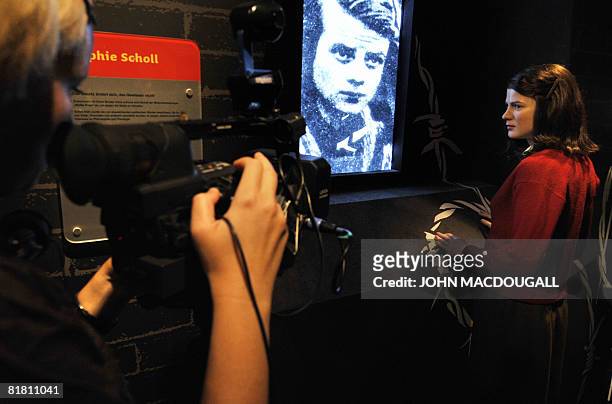 Camera woman shoots footage of a wax likeness of German WW II German resistance leader Sophie Scholl at Berlin's Madame Tussaud's wax museum, during...