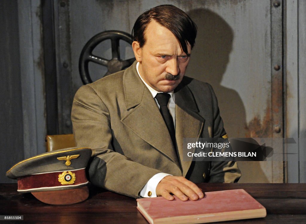 A wax likeness of Nazi dictator Adolf Hitler sits in Berlin's Madame ...