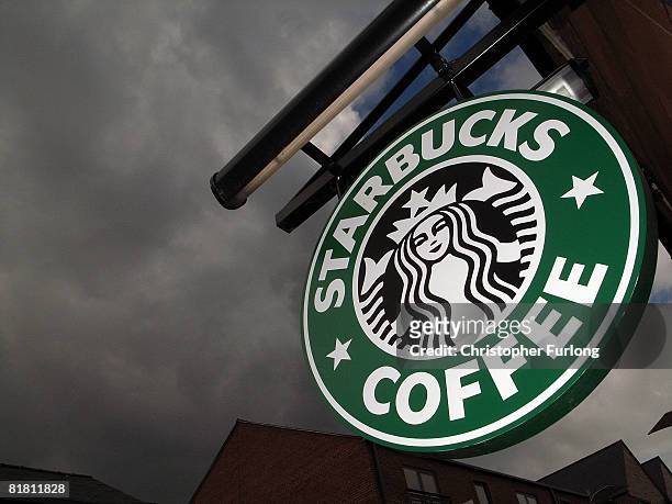 The Starbucks logo hangs outside one of the company's cafes in Northwich on 3 July, 2008 in Northwich, England. Starbucks Corp in the US recently...