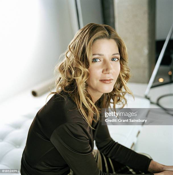 Writer Candace Bushnell poses for a portrait shoot in London for FHM magazine on March 14, 2002.