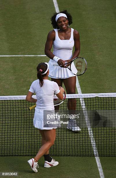 Serena Williams of United States is congratulated in winning the women's singles Semi Final match by Jie Zheng of China on day ten of the Wimbledon...
