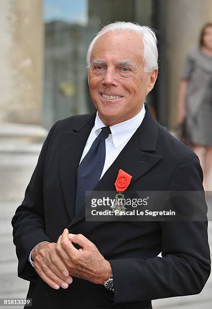 Italian fashion designer Giorgio Armani poses with his Legion of Honour medal in the courtyard of the Elysee Palace after attending a ceremony at the...