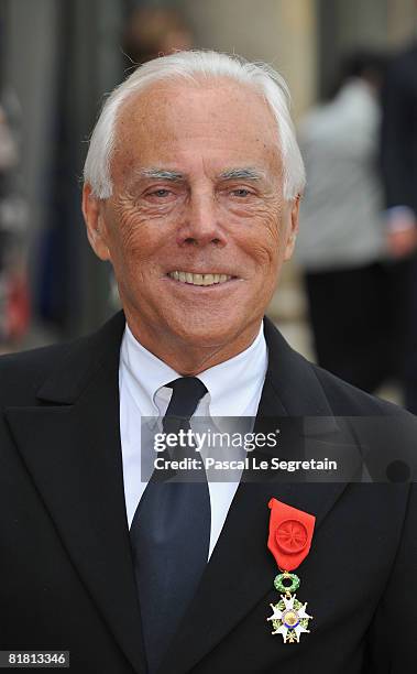 Italian fashion designer Giorgio Armani poses with his Legion of Honour medal in the courtyard of the Elysee Palace after attending a ceremony at the...